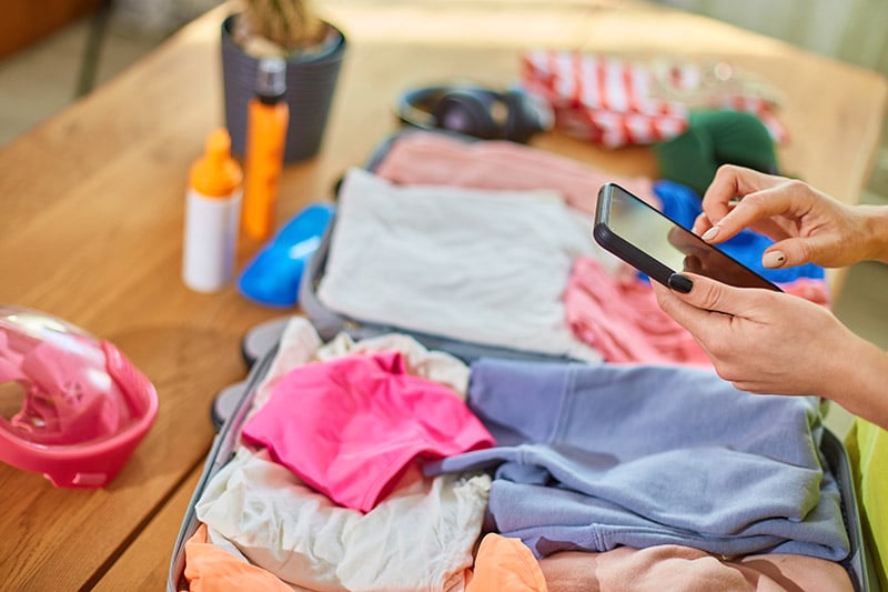 Organized clothing and woman on the phone