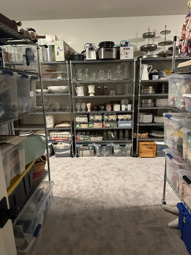 Organized walk-in closet by professional home organizing company