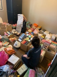 Packing up and organizing a room full of fabric